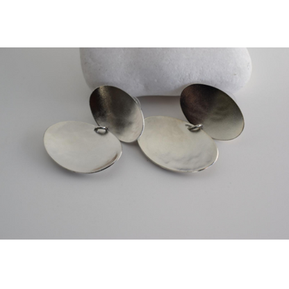 Heliades Earrings – Greek Hammered Jewelry – Available in 18K Gold, Silver, and Rose Gold Plated. Radiant hammered circular discs inspired by the daughters of the Sun.