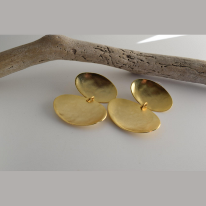 Heliades Earrings – Greek Hammered Jewelry – Available in 18K Gold, Silver, and Rose Gold Plated. Radiant hammered circular discs inspired by the daughters of the Sun.