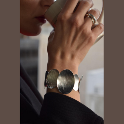 Ostraka Bracelet – Greek Hammered Jewelry – Available in 18K Gold, Silver, and Rose Gold Plated. Bold hammered ovals inspired by ancient shards and seashells.