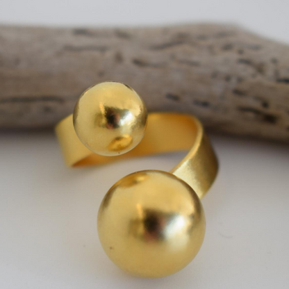 Sphaira Ring – Greek Hammered Jewelry – Available in 18K Gold, Silver, and Rose Gold Plated. Adjustable open ring with twin spheres, inspired by the ancient Greek symbol of the cosmos.