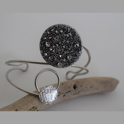 Handmade open cuff bracelet with crystals-studded disc inspired by the Milky Way, available in gold, silver, or rose gold plating.