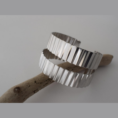 Rythmos Bracelet – Greek Hammered Jewelry – Available in 18K Gold, Silver, and Rose Gold Plated. Hammered vertical lines inspired by rhythm and ancient columns.