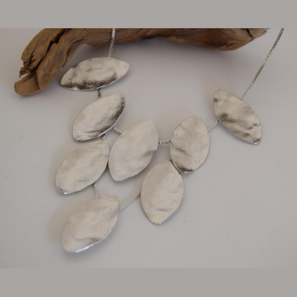 Handmade hammered necklace with gold-plated leaf shapes inspired by Greek nature and mythology.
