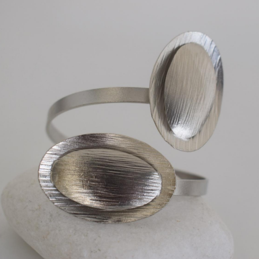 Nausicaa Bracelet – Handmade Greek hammered jewelry with oval textured design, available in 18K gold or silver plated finish.