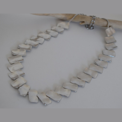 Handmade hammered necklace with rectangular gold-plated plates inspired by the poetic elegance of gold in ancient Greek culture.