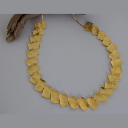 Handmade hammered necklace with rectangular gold-plated plates inspired by the poetic elegance of gold in ancient Greek culture.